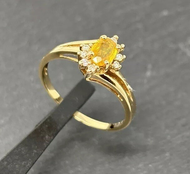 Gelbgold Ring gelber 0,7ct Saphir Brillanten Entourage 14K/585 